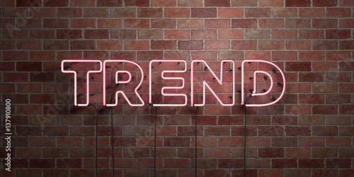 TREND - fluorescent Neon tube Sign on brickwork - Front view - 3D rendered royalty free stock picture. Can be used for online banner ads and direct mailers..