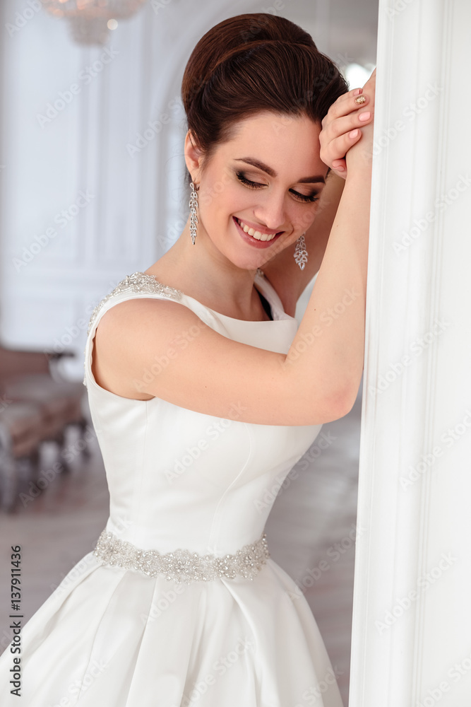 close-up portrait of beautiful brunette bride with elegant hairstyle and makeup wearing long luxury wedding dress close-up portrait of beautiful brunette bride with elegant hairstyle and makeup wearing long luxury wedding dress