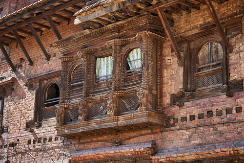 Traditional newar window with wooden carvings in Kirtipur, Nepal photo
