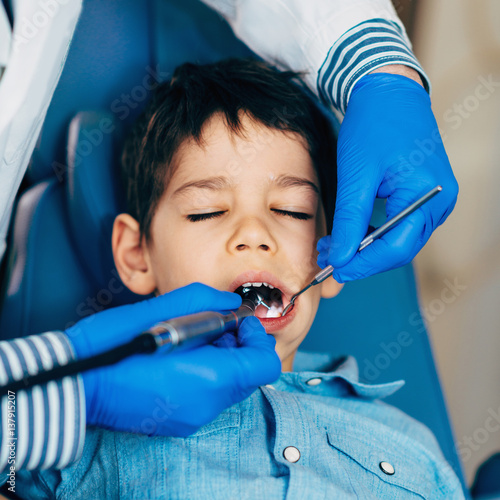 Dental drilling little boy's tooth