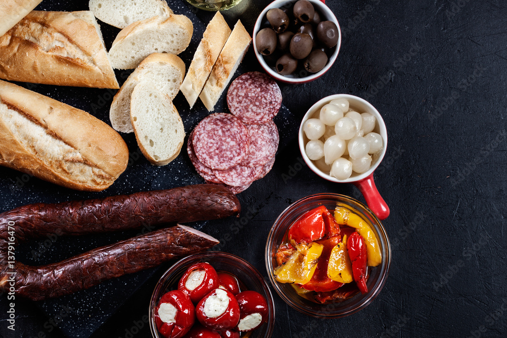 Spanish tapas with slices jamon serrano and grilled pepper. Also Spanish tapas with slices jamon serrano and grilled pepper. Also
