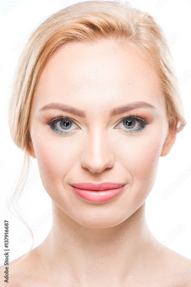 Close-up portrait of gorgeous young blonde woman smiling at camera, skincare concept Close-up portrait of gorgeous young blonde woman smiling at camera, skincare concept