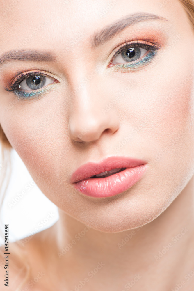 Close-up portrait of young sensual woman with stylish makeup looking at camera, skincare concept Close-up portrait of young sensual woman with stylish makeup looking at camera, skincare concept