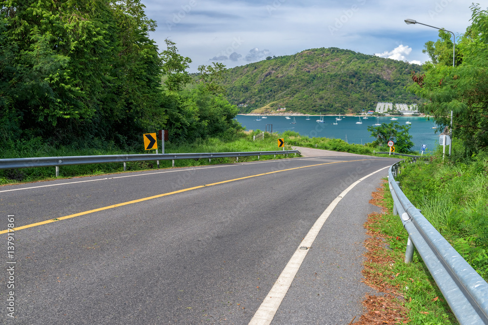 Asphalt road and sea in Phuket, Thailand. Asphalt road and sea in Phuket, Thailand.