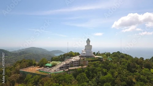 Phuket Big Buddha 45 Meter Tall White Marble Statue on the Mountain. HD Aerial shot. Thailand. photo