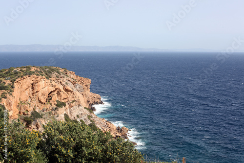 High cliff in Mediterranean sea, Greece 