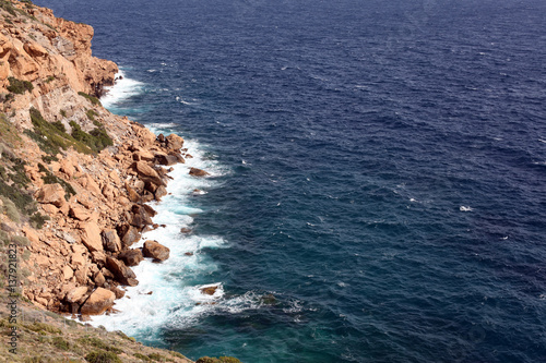 High cliff in Mediterranean sea, Greece 