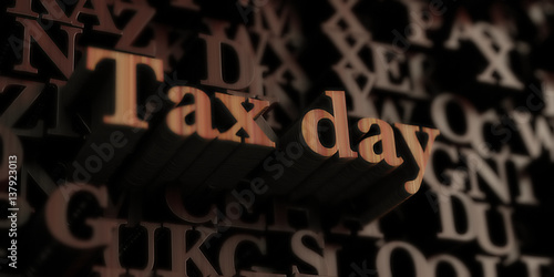 Tax Day - Wooden 3D rendered letters/message. Can be used for an online banner ad or a print postcard.