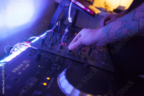 close up of hands of a music engineer working on the studio