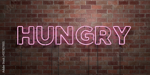 HUNGRY - fluorescent Neon tube Sign on brickwork - Front view - 3D rendered royalty free stock picture. Can be used for online banner ads and direct mailers.. photo