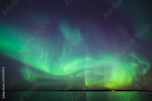 Northern lights over lake in finland