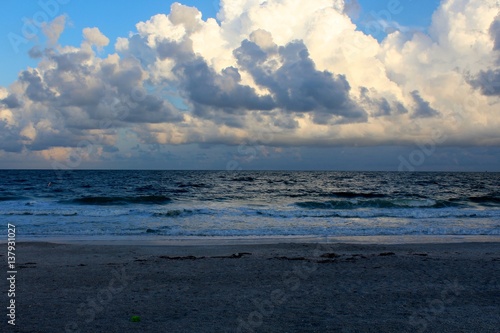 The clouds over the ocean water.