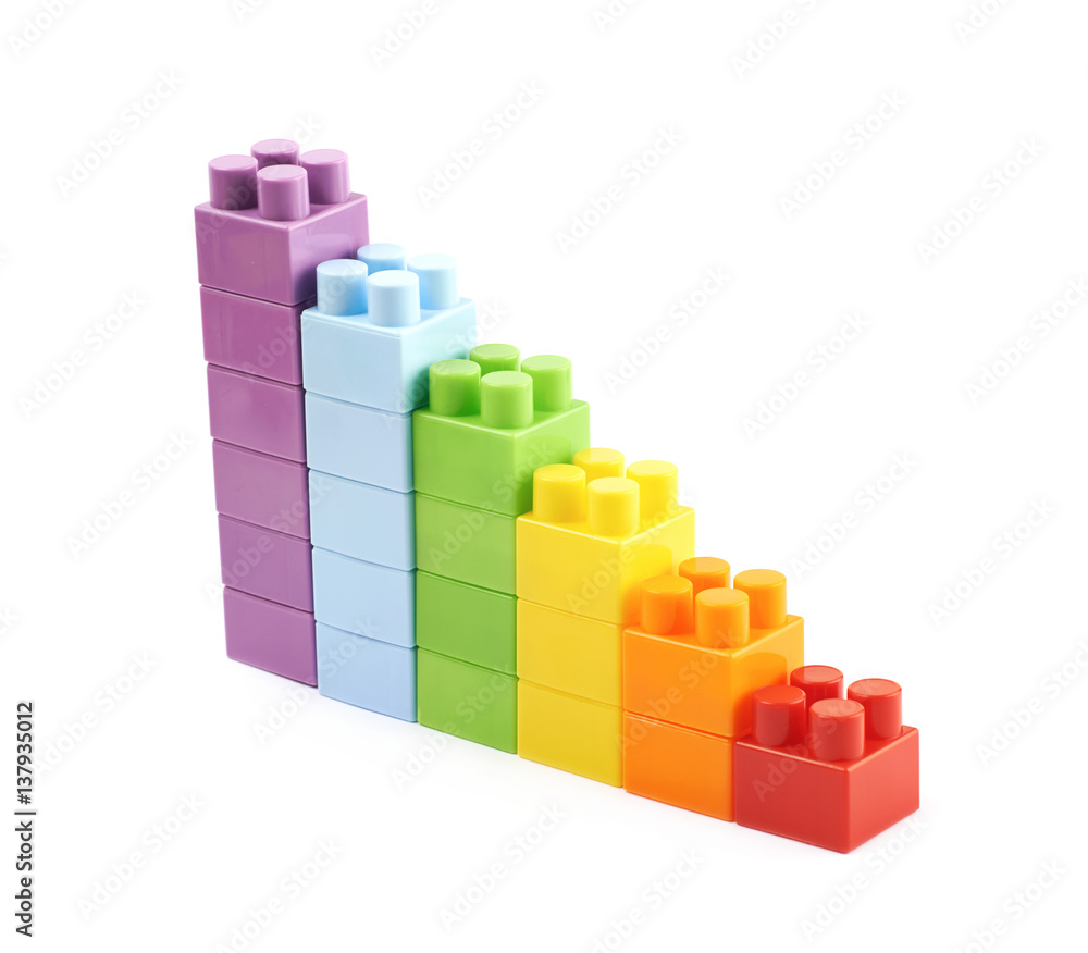 Growing stacks of toy bricks isolated