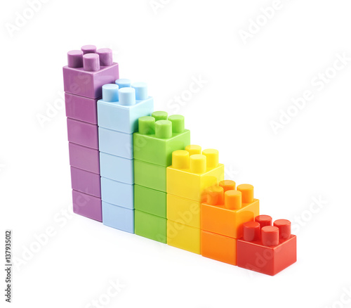 Growing stacks of toy bricks isolated