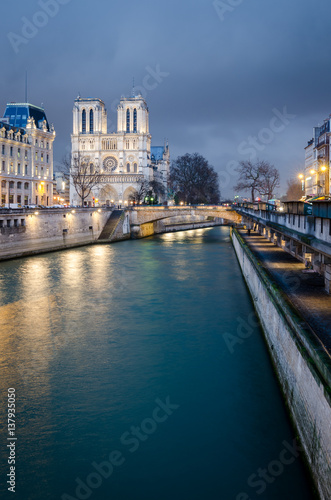 Notre-Dame de Paris and Seine river at blue hour