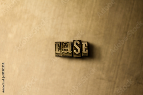 EASE - close-up of grungy vintage typeset word on metal backdrop. Royalty free stock illustration. Can be used for online banner ads and direct mail.