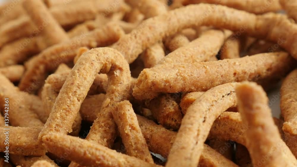 Grissini with chilli close-up 4K 2160p 30fps UltraHD panning footage - Tasty integral breadsticks snacks fried in oil slow pan Grissini with chilli close-up 4K 2160p 30fps UltraHD panning footage - Tasty integral breadsticks snacks fried in oil slow pan