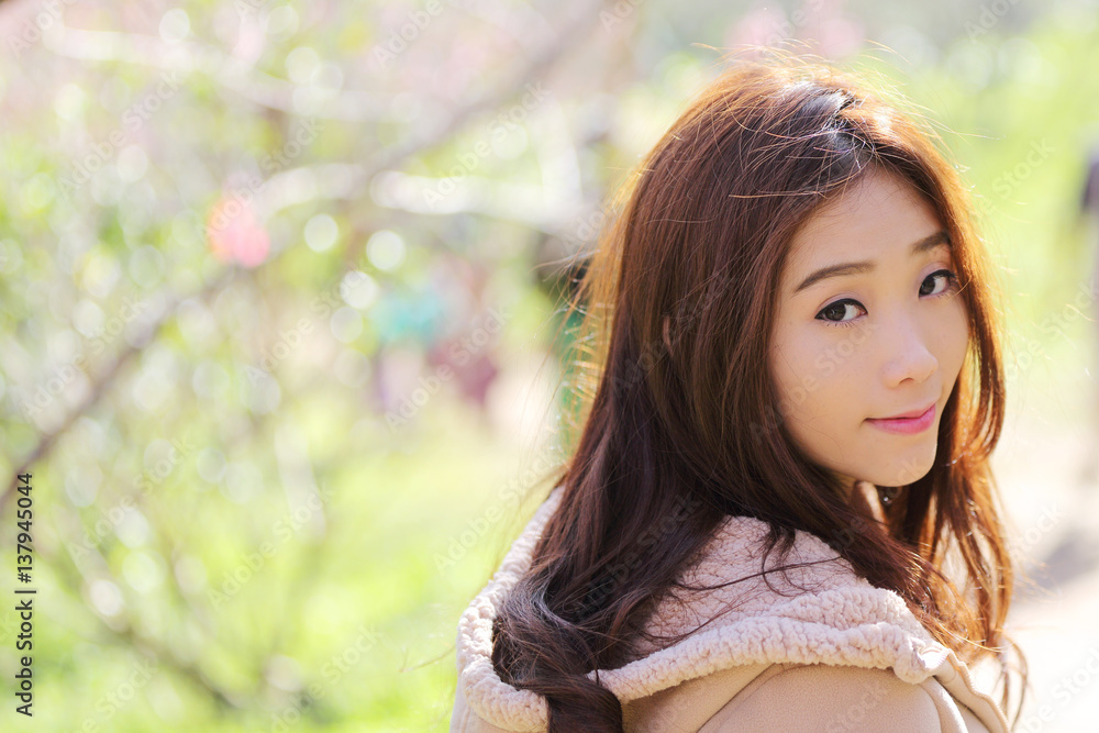 beautiful young woman with blooming cherry blossoms sakura flowers beautiful young woman with blooming cherry blossoms sakura flowers