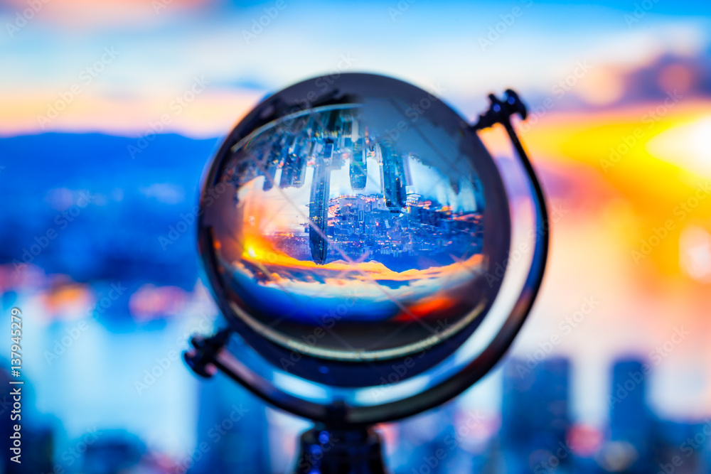 Crystal globe reflection cityscape building inside with blur background Crystal globe reflection cityscape building inside with blur background