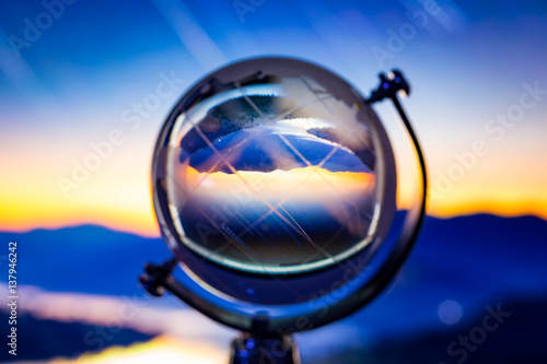 Crystal globe reflection cityscape inside © teerawutbunsom