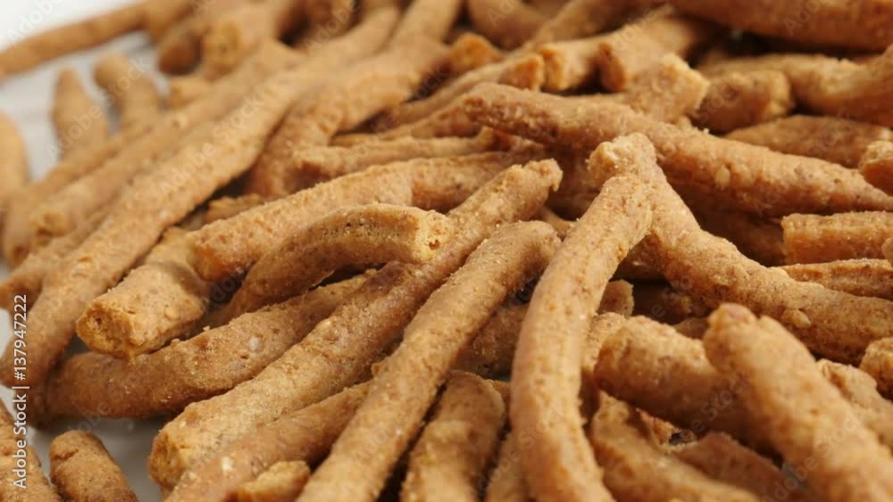Slow pan on tasty integral breadsticks snacks fried in oil 4K 2160p 30fps UltraHD footage - Panning on grissini with chilli Slow pan on tasty integral breadsticks snacks fried in oil 4K 2160p 30fps UltraHD footage - Panning on grissini with chilli