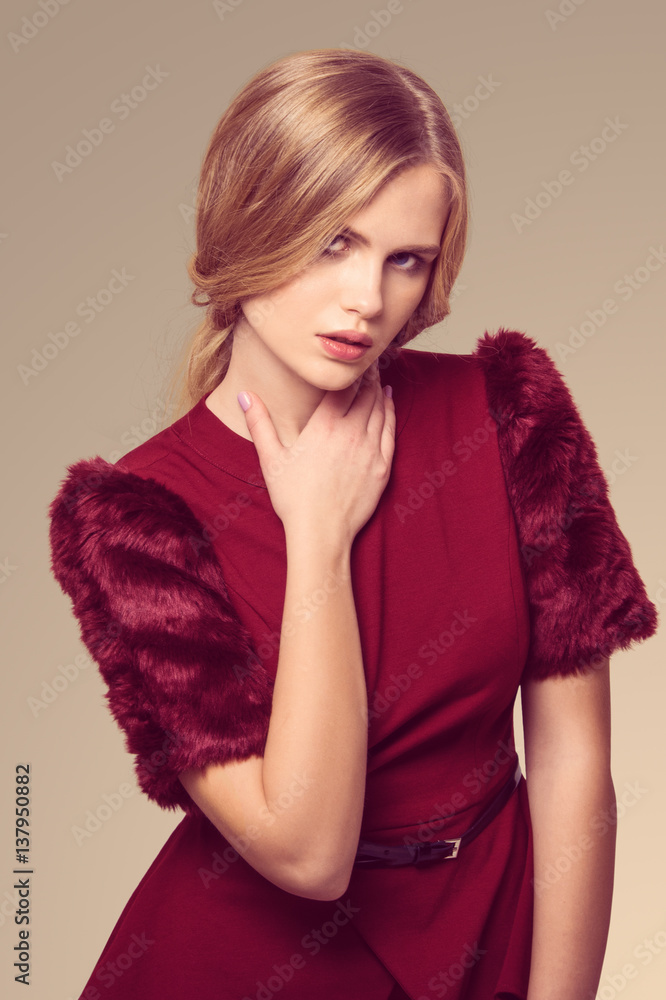 beautiful blonde woman posing in burgundy dress beautiful blonde woman posing in burgundy dress
