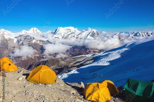 High Altitude Camp of Mountain Expedition Summits on Horizon