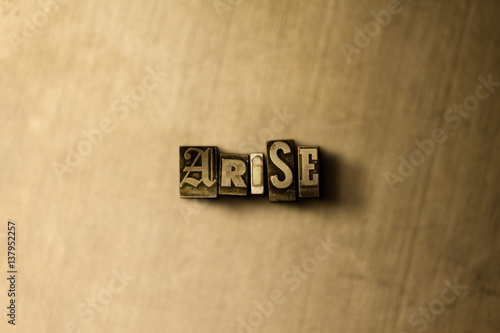 Fotografie, Tablou ARISE - close-up of grungy vintage typeset word on metal backdrop