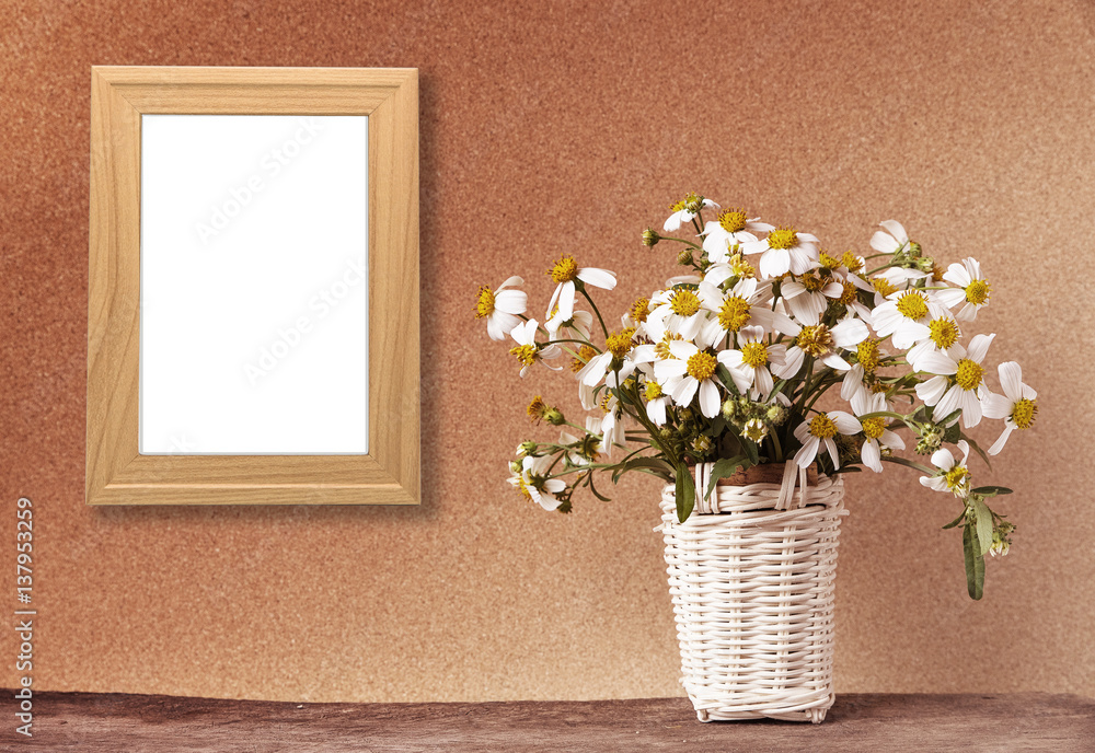 blank wooden frame mockup with basket of chamomile flowers blank wooden frame mockup with basket of chamomile flowers