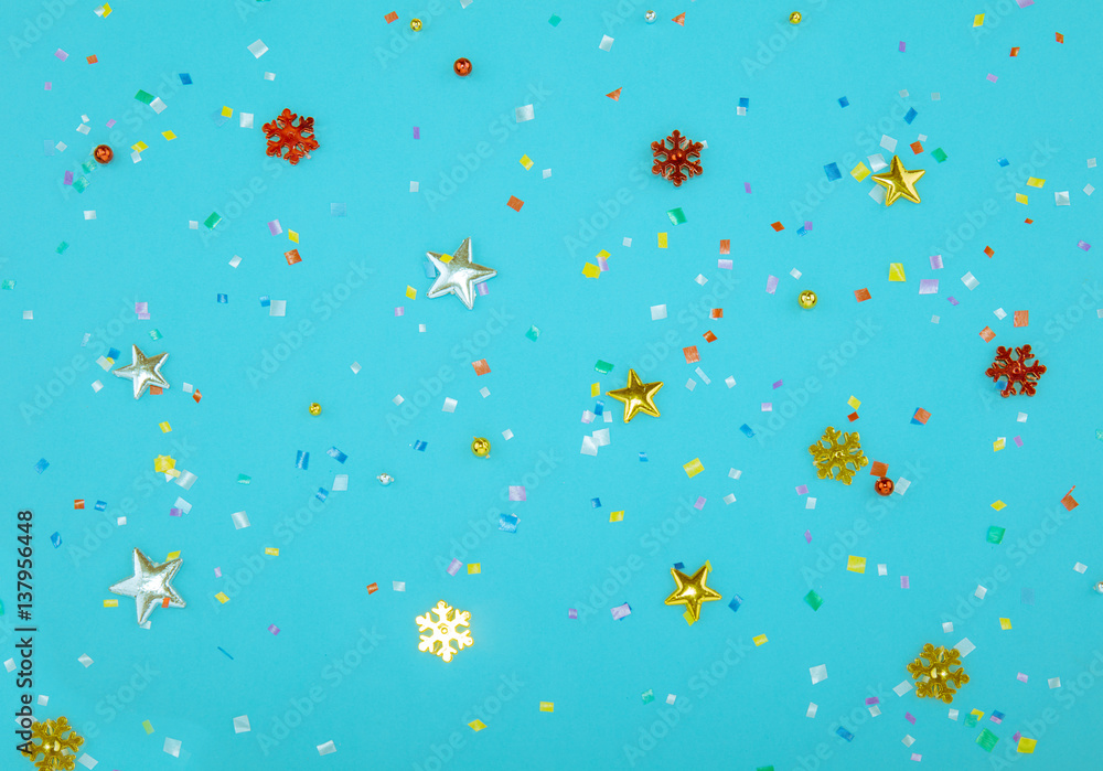 Red, yellow and green heart and circle confetti on a blue background. Red, yellow and green heart and circle confetti on a blue background.
