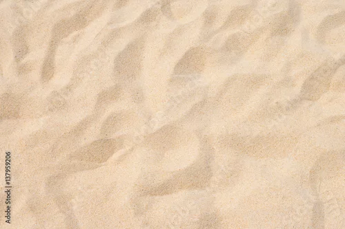 Obraz Drobny piasek plażowy w letnim słońcu