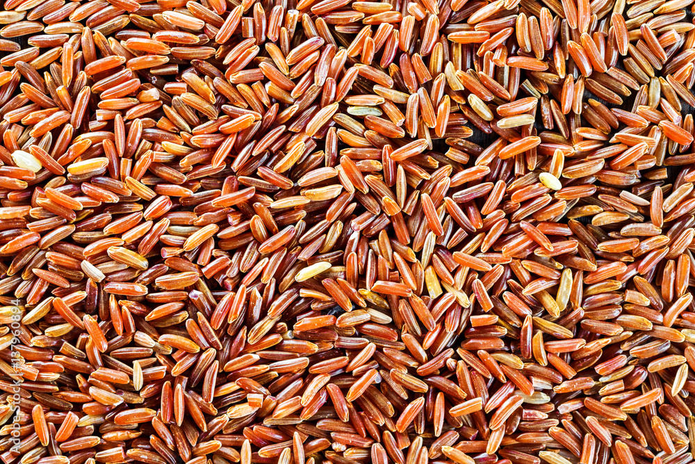 Macro texture of wild brown rice as food background.