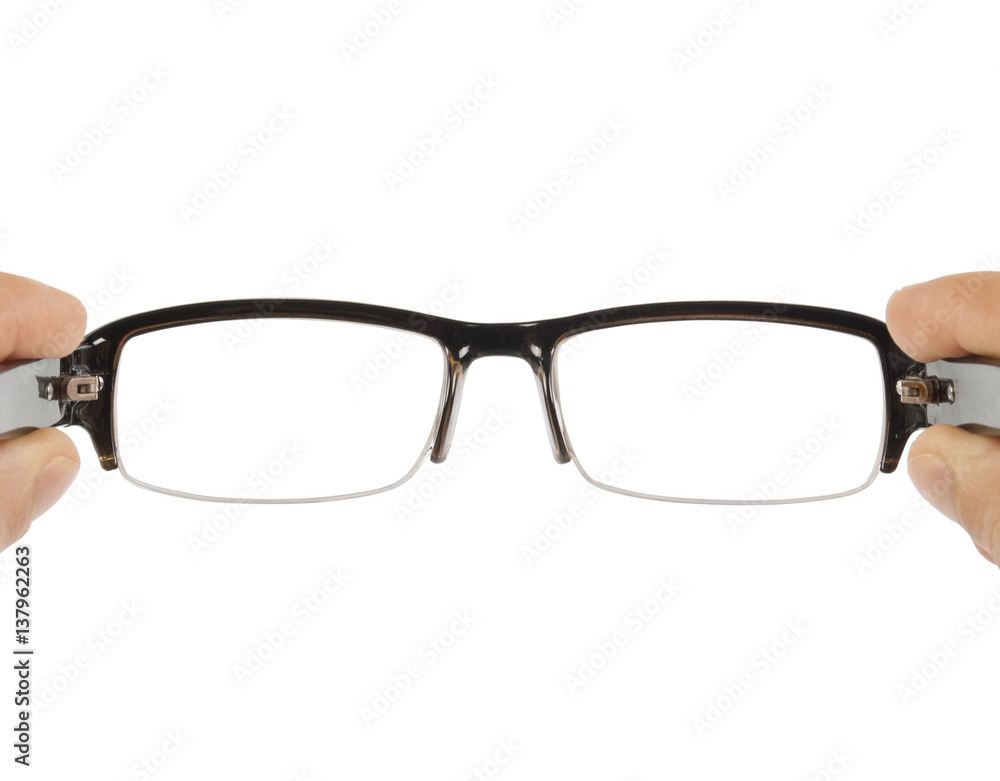 hands holding black glasses on white background hands holding black glasses on white background