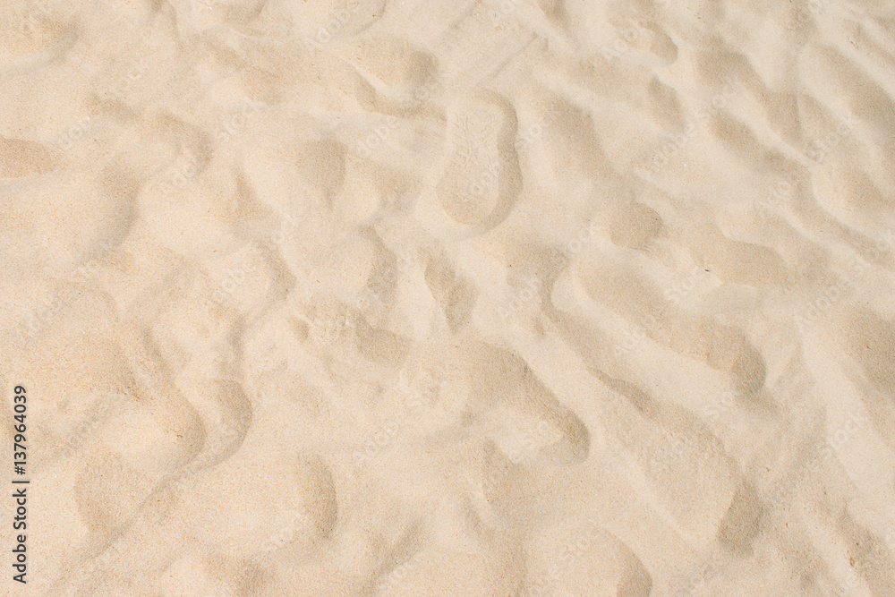 Fine beach sand in the summer sun Fine beach sand in the summer sun