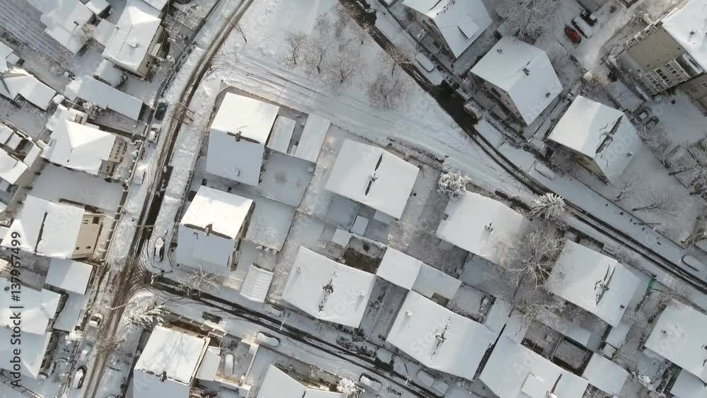 aerial view of houses in suburbs covered in snow
aerial view of houses in suburbs covered in snow