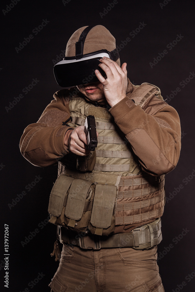 Portrait soldier or private military contractor holding rifle. Portrait soldier or private military contractor holding rifle.
