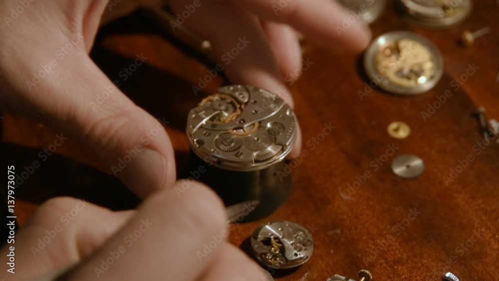 watchmaker working on watch close up detail watchmaker working on watch close up detail