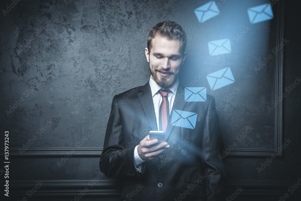 Young businessman with a smartphone Young businessman with a smartphone