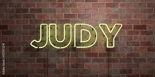JUDY - fluorescent Neon tube Sign on brickwork - Front view - 3D rendered royalty free stock picture. Can be used for online banner ads and direct mailers..