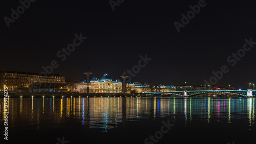 Lyon University bridge by night with fantastic river reflection