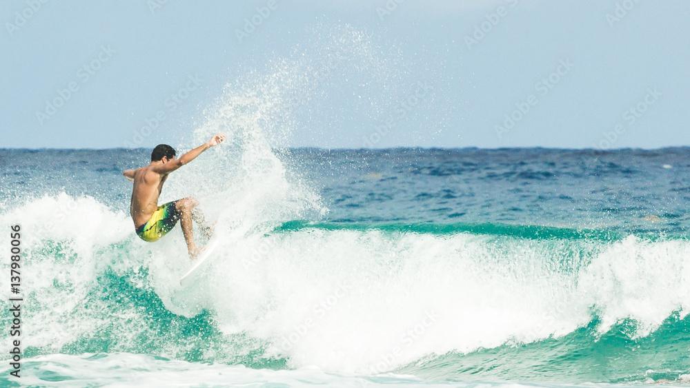 Male surfer riding the waves of the Atlantic Ocean Male surfer riding the waves of the Atlantic Ocean