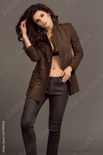 Amazing women in brown jacet and jeans. photo