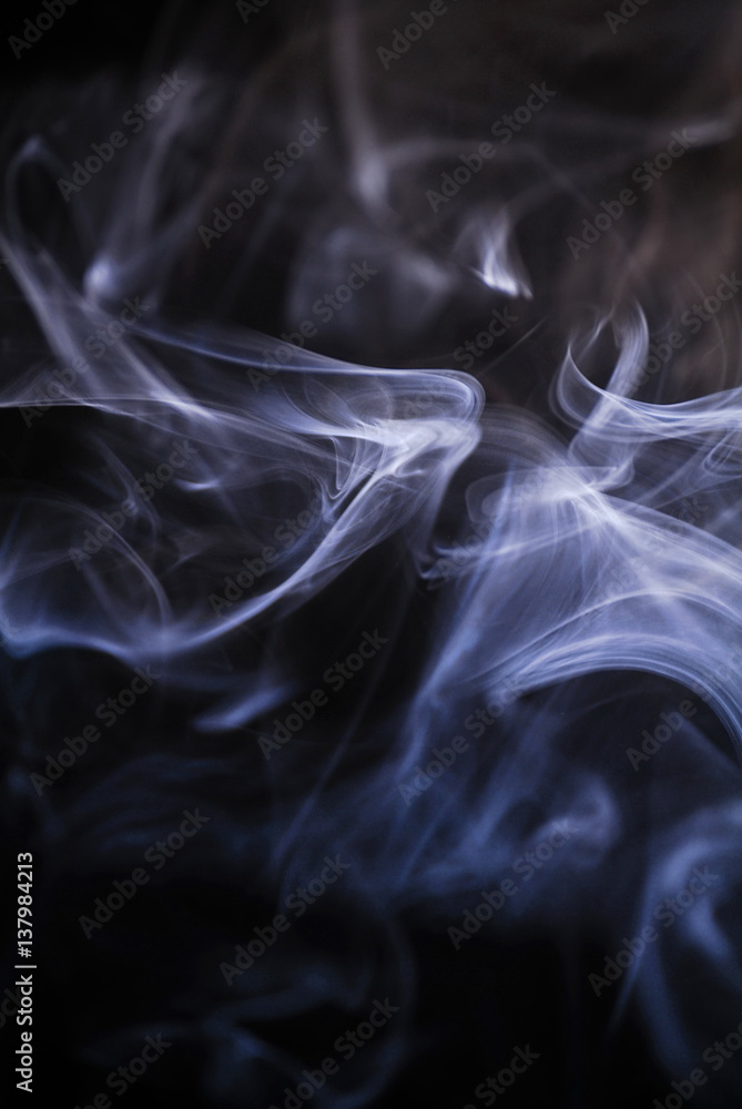 Obraz premium smoke curls on black background