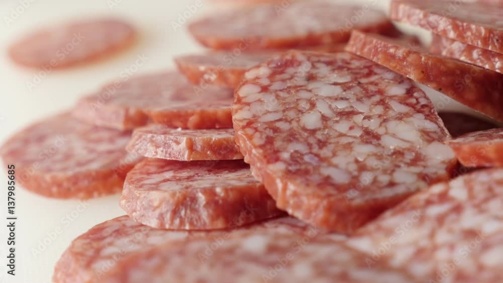Cured sausage of air-dried meat cuts panning 4K 2160p 30fps UltraHD footage - Tasty dry salami smaller pieces served on plate food background slow pan 3840X2160 UHD video Cured sausage of air-dried meat cuts panning 4K 2160p 30fps UltraHD footage - Tasty dry salami smaller pieces served on plate food background slow pan 3840X2160 UHD video
