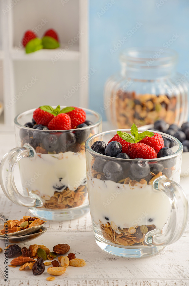 Yogurt parfait with granola and fresh berries, healthy breakfast concept, selective focus Yogurt parfait with granola and fresh berries, healthy breakfast concept, selective focus