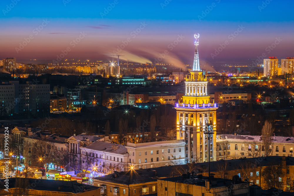Night cityscape of Voronezh, view from rooftop of skyscraper, Tower in architecture Stalinist empire with star illuminated by colored lights