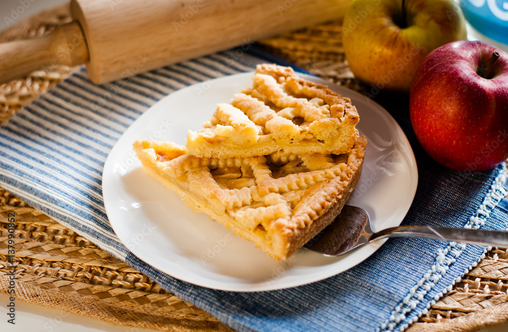 home made apple tart on a white plate home made apple tart on a white plate