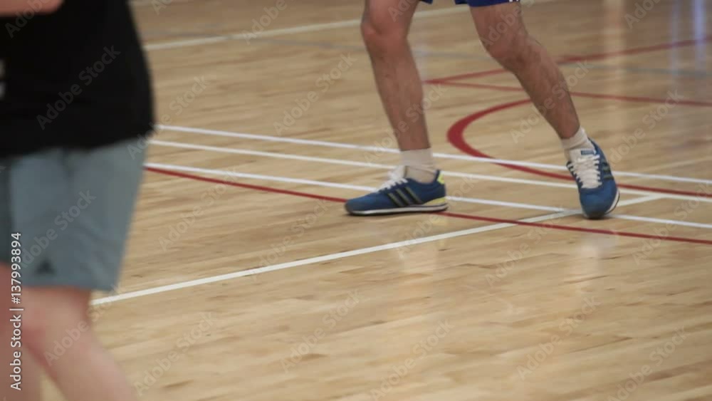 People playing volleyball indoors shot People playing volleyball indoors shot