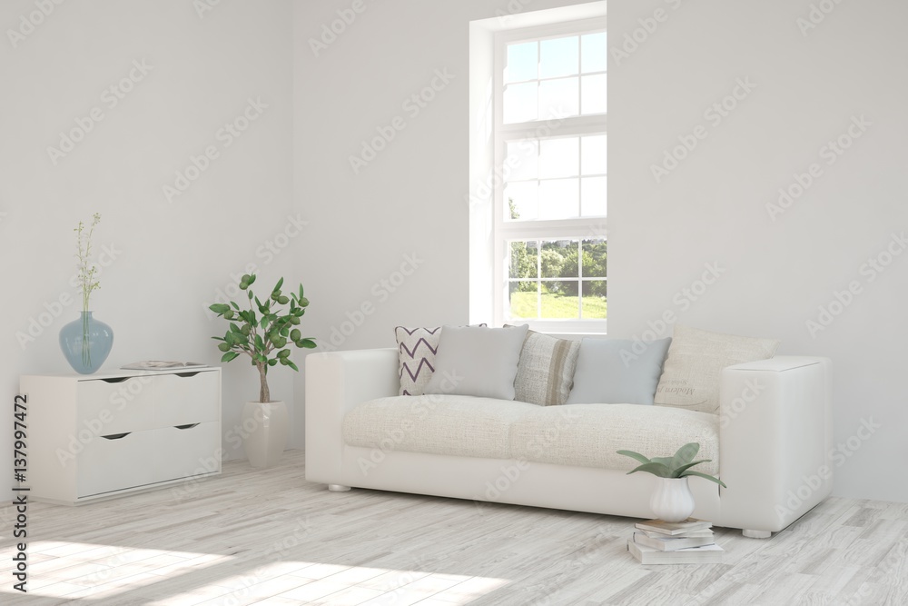 White room with sofa and green landscape in window. Scandinavian interior design White room with sofa and green landscape in window. Scandinavian interior design