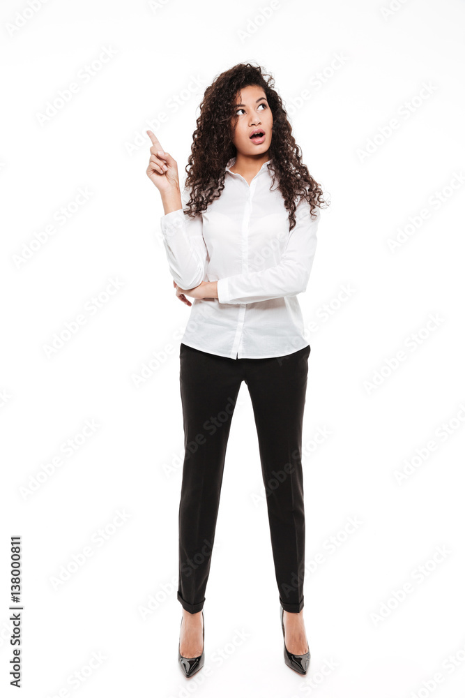 Attractive young curly african lady posing over white background Attractive young curly african lady posing over white background